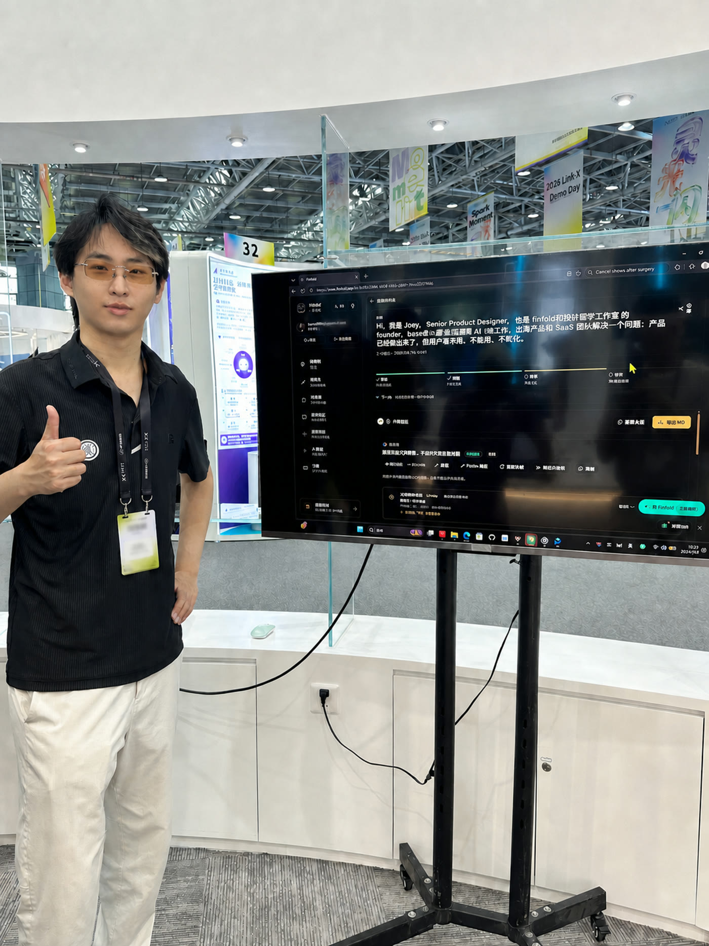 Joey Zhao beside a live Finfold demo at the 2026 Link-X Demo Day